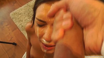A Russian Beauty Gets Her Mouth Stretched By A Massive Cock Before Being Painted With A Thick, Messy Load.