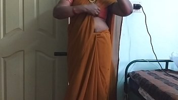Desi Beauty In A Vibrant Saree, Her Big Boobs And Shaved Pussy On Display As She Teases Herself With Eager Hands, Moaning Softly As She Rubs And Presses Her Sensitive Spots.