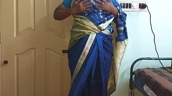 A Sultry Indian Wife In A Blue Saree Teases With Her Big Boobs And Shaved Pussy, Pressing And Rubbing Herself Until She Can’t Hold Back.